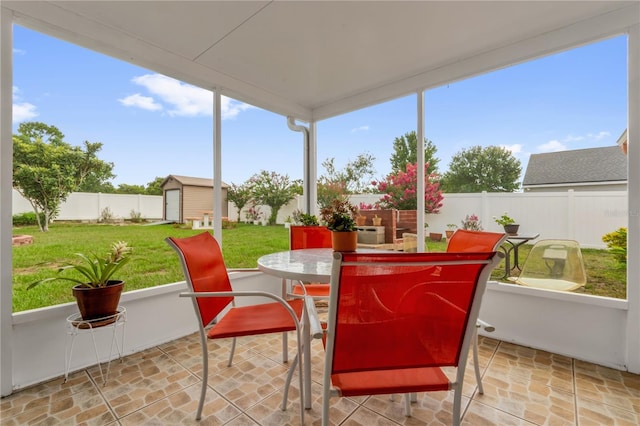 1366 Merrimack Pl, Davenport, FL 33837 - sunroom featuring outdoor dining space, stone finish floors, and plenty of natural light