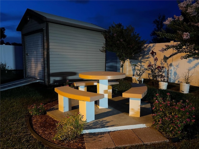 1366 Merrimack Pl, Davenport, FL 33837 - property exterior at twilight with an outbuilding