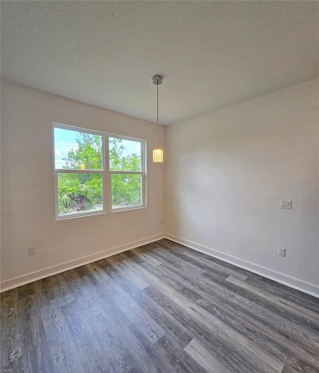 3040 W Joliet Rd, Avon Park, FL 33825 - unfurnished room featuring dark wood-type flooring and baseboards