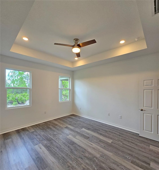 3040 W Joliet Rd, Avon Park, FL 33825 - unfurnished room with a tray ceiling, ceiling fan, dark wood-type flooring, and recessed lighting