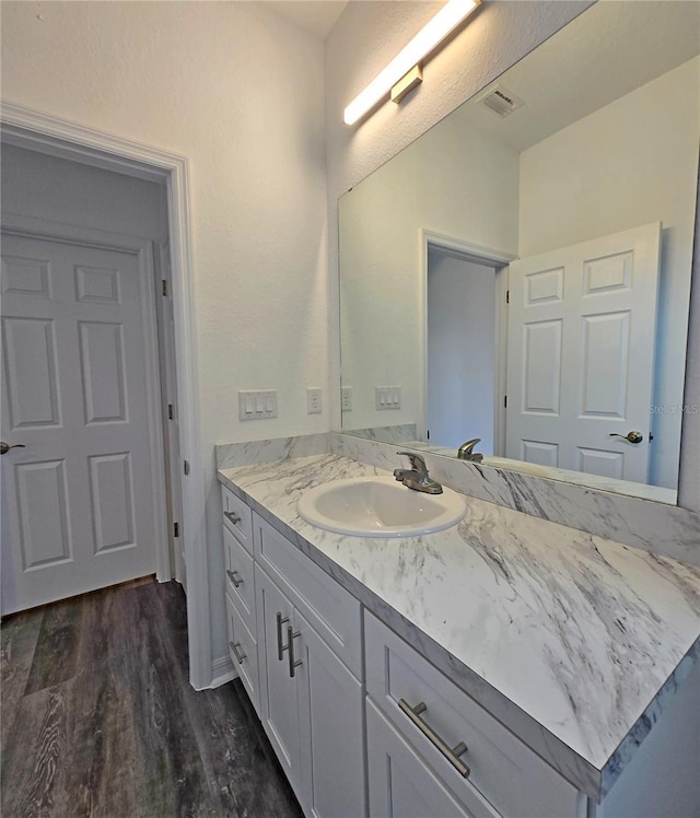 3040 W Joliet Rd, Avon Park, FL 33825 - bathroom featuring vanity and wood finished floors