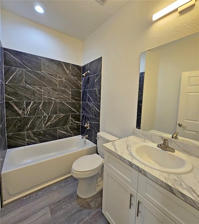 3040 W Joliet Rd, Avon Park, FL 33825 - full bathroom featuring vanity, tub / shower combination, and wood finished floors