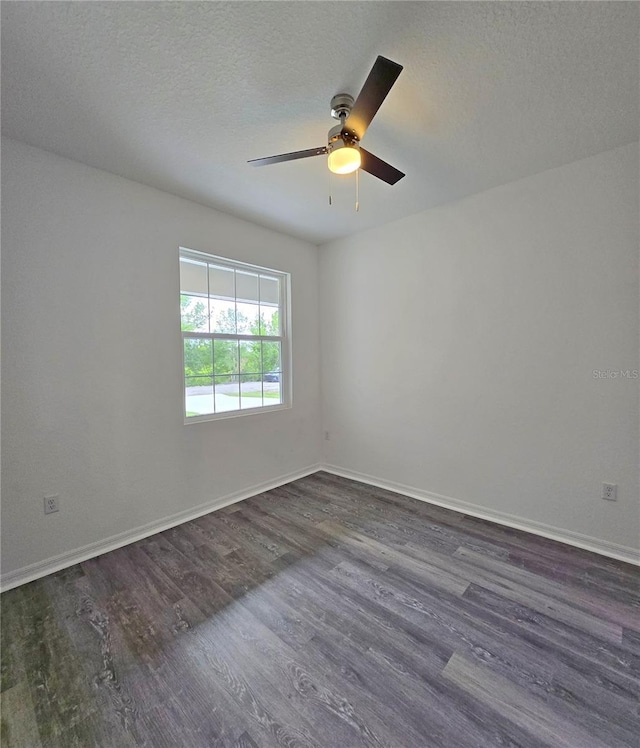 3040 W Joliet Rd, Avon Park, FL 33825 - spare room featuring dark wood finished floors, ceiling fan, and a textured ceiling