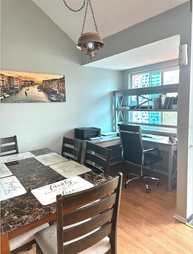 7906 Waterview Way Unit 7906, Winter Haven, FL 33884 - office featuring wood finished floors, a textured ceiling, and lofted ceiling