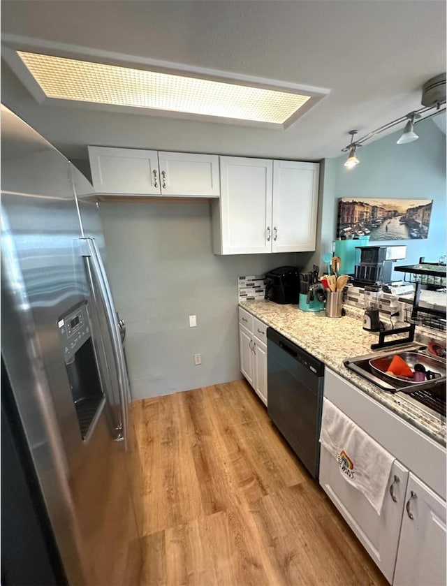 7906 Waterview Way Unit 7906, Winter Haven, FL 33884 - kitchen featuring dishwashing machine, stainless steel fridge with ice dispenser, white cabinetry, light wood-style floors, and light stone counters