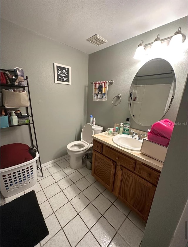7906 Waterview Way Unit 7906, Winter Haven, FL 33884 - half bath with vanity, tile patterned floors, and a textured ceiling