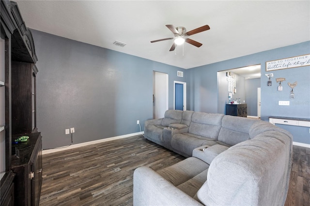 4662 Osprey Way, Winter Haven, FL 33881 - living area with ceiling fan and dark wood-style floors