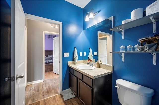4662 Osprey Way, Winter Haven, FL 33881 - ensuite bathroom with wood finished floors and vanity