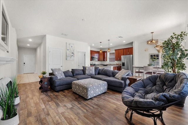 8720 Micmac Ct, Polk City, FL 33868 - living room with wood finished floors and recessed lighting