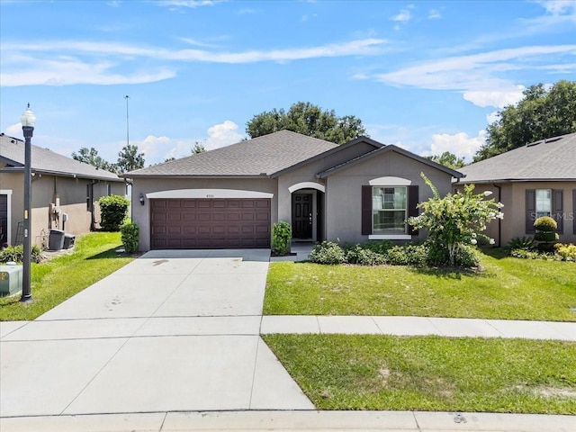 8720 Micmac Ct, Polk City, FL 33868 - ranch-style home with a garage, concrete driveway, a front yard, and stucco siding
