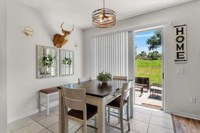 8720 Micmac Ct, Polk City, FL 33868 - dining area featuring baseboards and light tile patterned floors