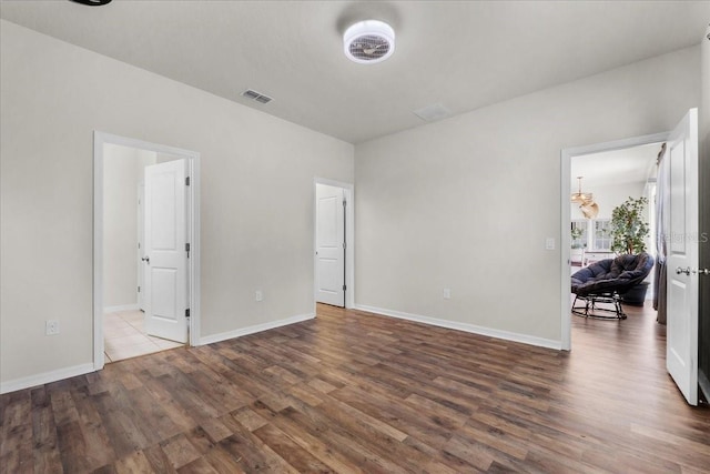 8720 Micmac Ct, Polk City, FL 33868 - unfurnished bedroom with wood finished floors and baseboards
