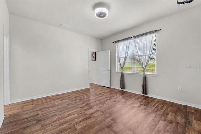 8720 Micmac Ct, Polk City, FL 33868 - unfurnished room with wood finished floors