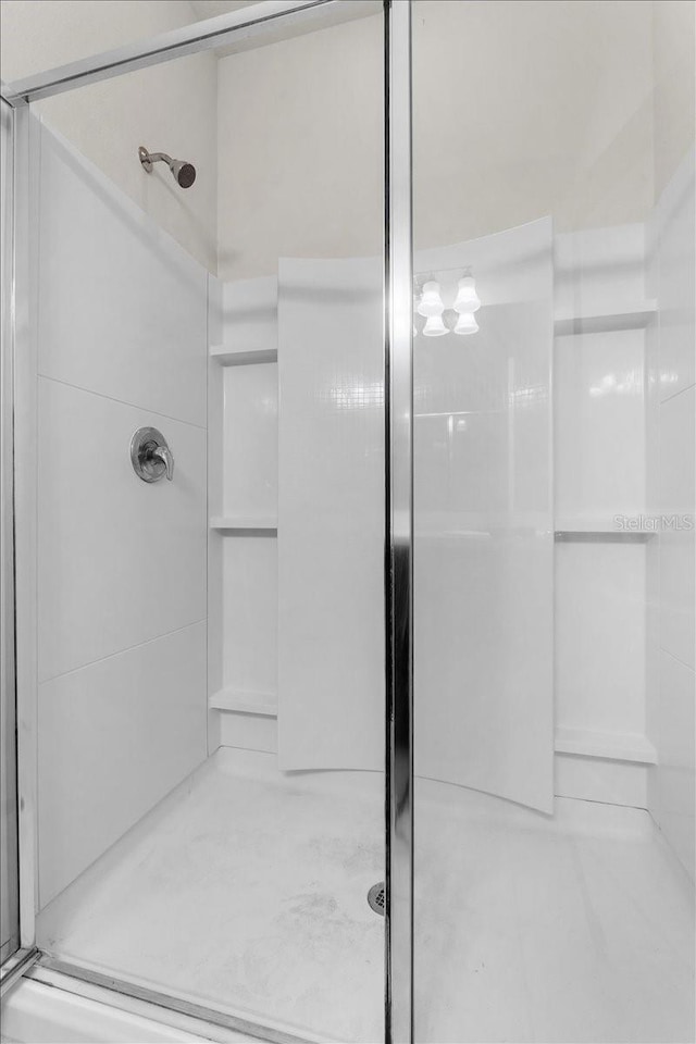 8720 Micmac Ct, Polk City, FL 33868 - bathroom with a shower stall