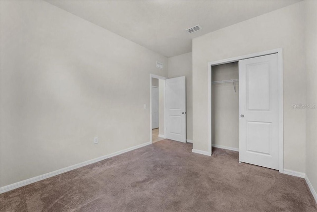 8720 Micmac Ct, Polk City, FL 33868 - unfurnished bedroom with carpet floors and a closet