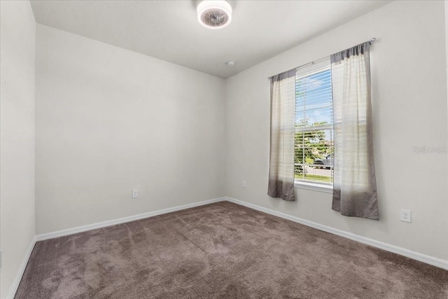 8720 Micmac Ct, Polk City, FL 33868 - carpeted spare room with baseboards