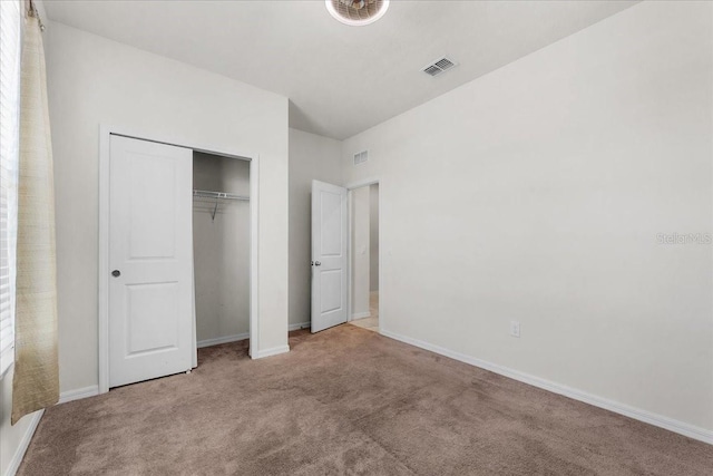 8720 Micmac Ct, Polk City, FL 33868 - unfurnished bedroom featuring carpet and a closet