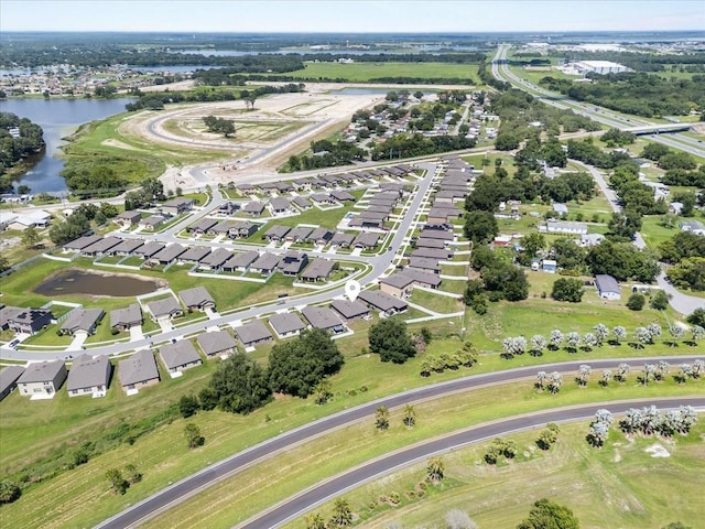 8720 Micmac Ct, Polk City, FL 33868 - aerial overview of property's location featuring a nearby body of water and nearby suburban area