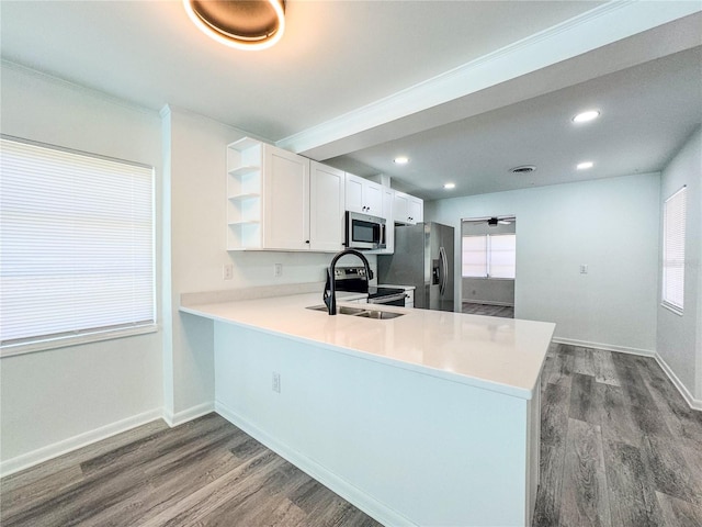 938 Glenwood Ave, Sebring, FL 33870 - kitchen with appliances with stainless steel finishes, open shelves, dark wood finished floors, white cabinetry, and light countertops