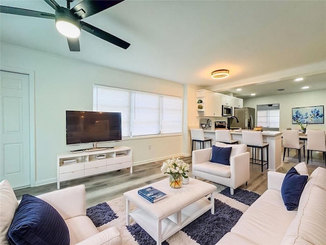 938 Glenwood Ave, Sebring, FL 33870 - living room featuring a ceiling fan, light wood finished floors, and recessed lighting