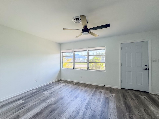 938 Glenwood Ave, Sebring, FL 33870 - unfurnished room with dark wood finished floors and a ceiling fan
