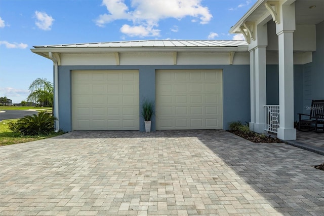 545 Pond Cypress Ct, Auburndale, FL 33823 - garage featuring decorative driveway