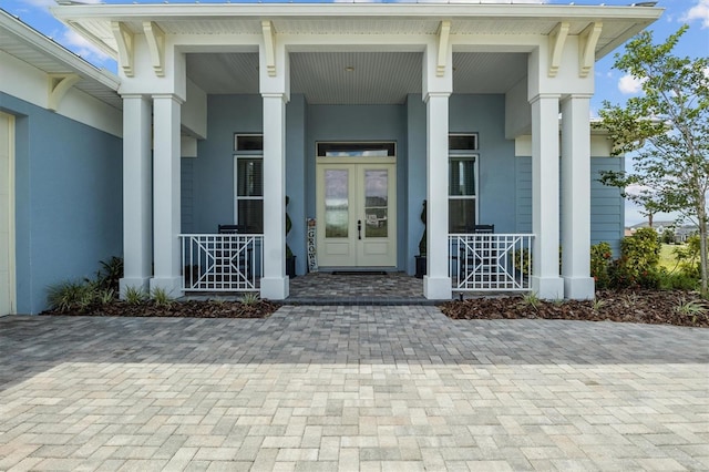 545 Pond Cypress Ct, Auburndale, FL 33823 - property entrance with a porch and stucco siding