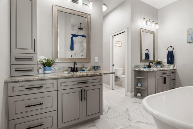 545 Pond Cypress Ct, Auburndale, FL 33823 - full bath with marble look tiles, a freestanding bath, vanity, and a shower