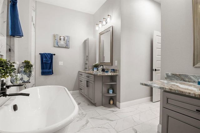 545 Pond Cypress Ct, Auburndale, FL 33823 - bathroom featuring a soaking tub, vanity, and marble finish flooring