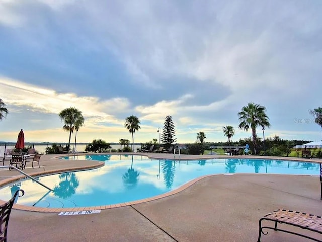 545 Pond Cypress Ct, Auburndale, FL 33823 - community pool featuring a patio