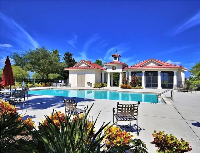 545 Pond Cypress Ct, Auburndale, FL 33823 - community pool featuring a patio