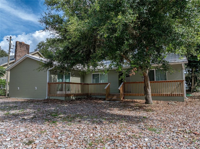 914 Mangham Rd, Babson Park, FL 33827 - back of house featuring a chimney and covered porch