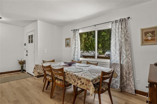 914 Mangham Rd, Babson Park, FL 33827 - dining area with light wood finished floors and a textured ceiling