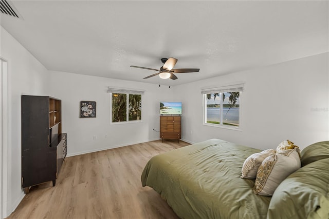 914 Mangham Rd, Babson Park, FL 33827 - bedroom with multiple windows, light wood-style floors, and ceiling fan