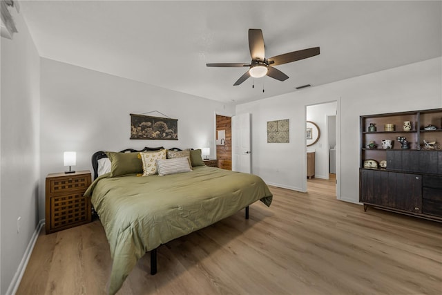 914 Mangham Rd, Babson Park, FL 33827 - bedroom featuring wood finished floors, connected bathroom, and a ceiling fan