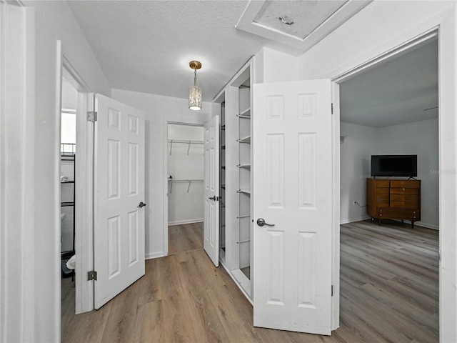 914 Mangham Rd, Babson Park, FL 33827 - corridor featuring wood finished floors and baseboards