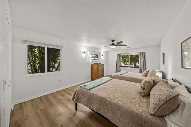 914 Mangham Rd, Babson Park, FL 33827 - bedroom with wood finished floors and ceiling fan