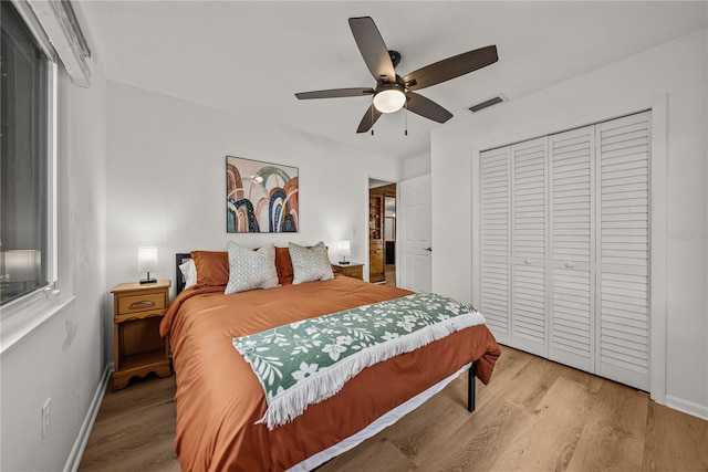 914 Mangham Rd, Babson Park, FL 33827 - bedroom featuring light wood finished floors, a closet, and a ceiling fan