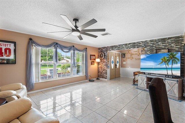 611 Caddy Dr, Kissimmee, FL 34759 - living room with a ceiling fan, a textured ceiling, and crown molding