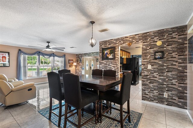 611 Caddy Dr, Kissimmee, FL 34759 - dining space with ceiling fan, a textured ceiling, and light tile patterned floors
