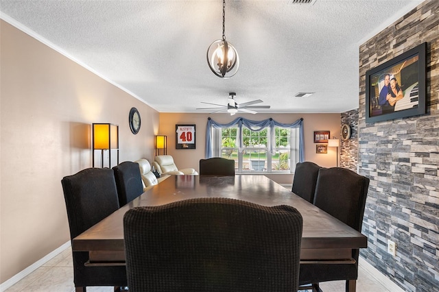 611 Caddy Dr, Kissimmee, FL 34759 - dining area with a textured ceiling, ceiling fan, and crown molding