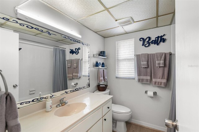 611 Caddy Dr, Kissimmee, FL 34759 - full bath featuring vanity, a shower with shower curtain, and wood finished floors