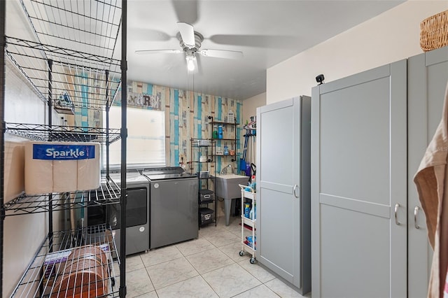 611 Caddy Dr, Kissimmee, FL 34759 - laundry room with independent washer and dryer, ceiling fan, and light tile patterned floors