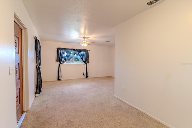 2125 Hillcrest Rd, Auburndale, FL 33823 - spare room with a ceiling fan and light carpet