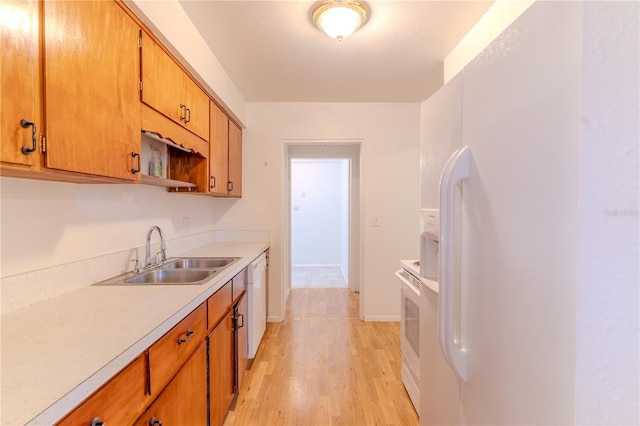 2125 Hillcrest Rd, Auburndale, FL 33823 - kitchen with white appliances, light countertops, light wood finished floors, brown cabinetry, and open shelves