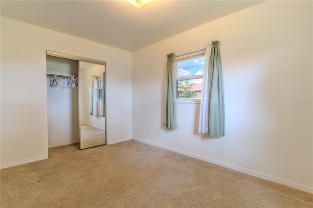2125 Hillcrest Rd, Auburndale, FL 33823 - unfurnished bedroom featuring light carpet and a closet