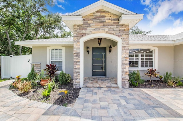 1823 N Olivia Dr, Avon Park, FL 33825 - view of exterior entry featuring stucco siding and stone siding