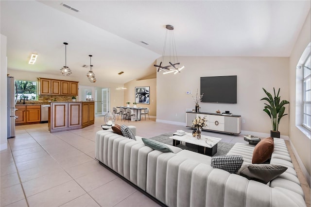 1823 N Olivia Dr, Avon Park, FL 33825 - living area featuring lofted ceiling, light tile patterned flooring, and a chandelier