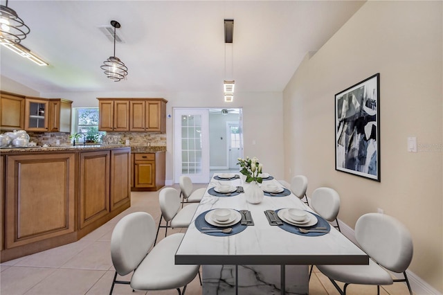 1823 N Olivia Dr, Avon Park, FL 33825 - dining room with vaulted ceiling and light tile patterned floors