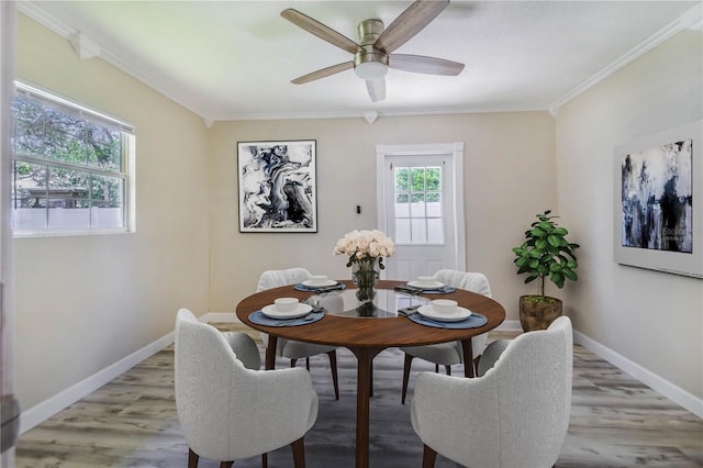 1823 N Olivia Dr, Avon Park, FL 33825 - dining space with crown molding, a ceiling fan, and light wood-style floors